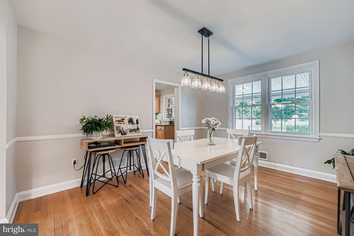 1552 Cottage Lane Towson, MD 21286 - Photo 8 of 32 a view of a dining room with furniture window and wooden floor