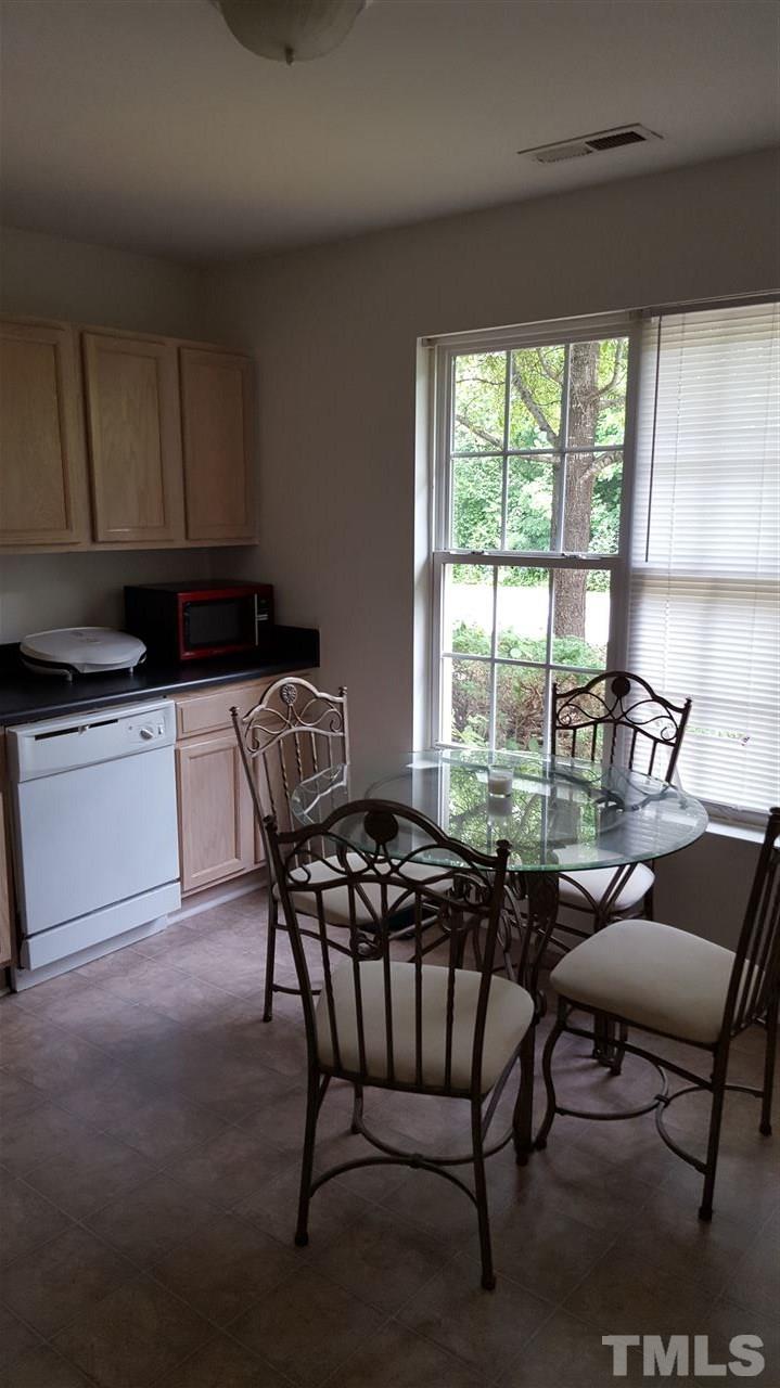 23 Red Lane Raleigh, NC 27606 - Photo 3 of 3 a dining room with furniture and a large window