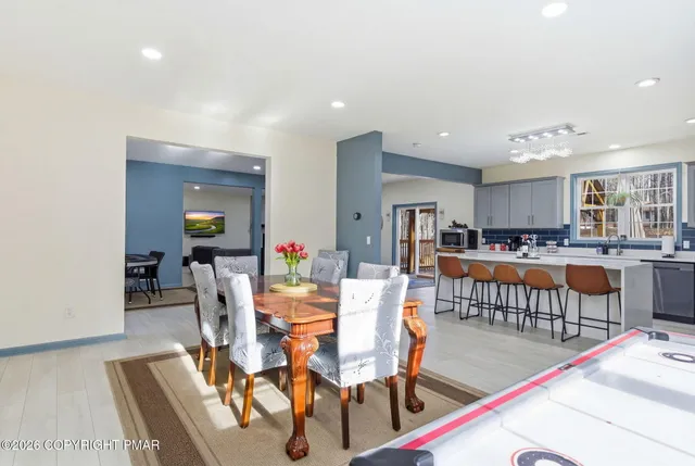 a spacious bedroom with a bed and a large window