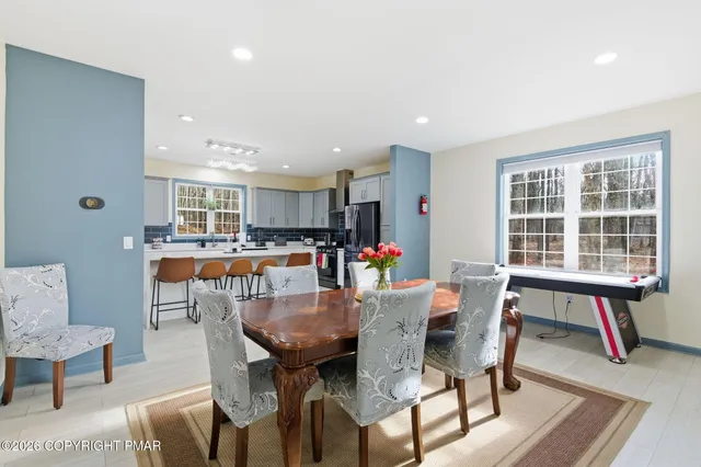 a living room with furniture and a table