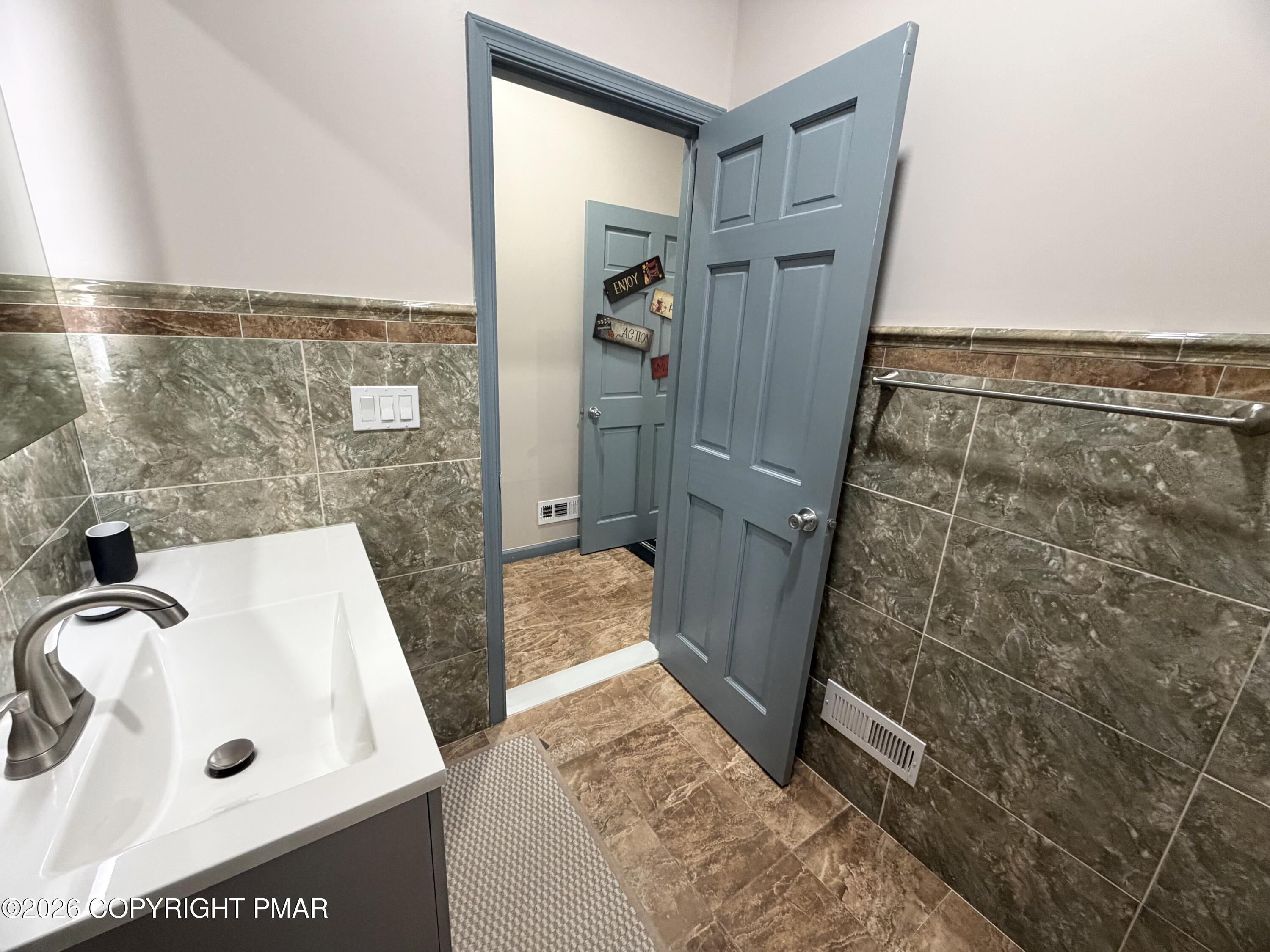 74 Buckhill Road Albrightsville, PA 18210 - Photo 23 of 65 a bathroom with a tub a sink and a shower
