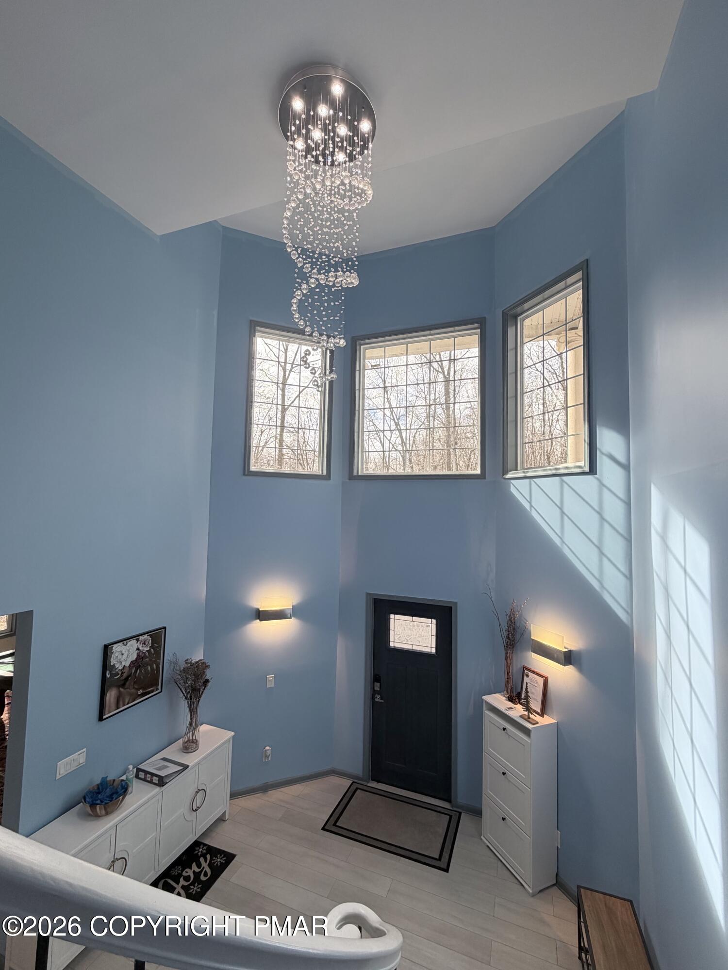 74 Buckhill Road Albrightsville, PA 18210 - Photo 29 of 65 a living room with furniture and a chandelier