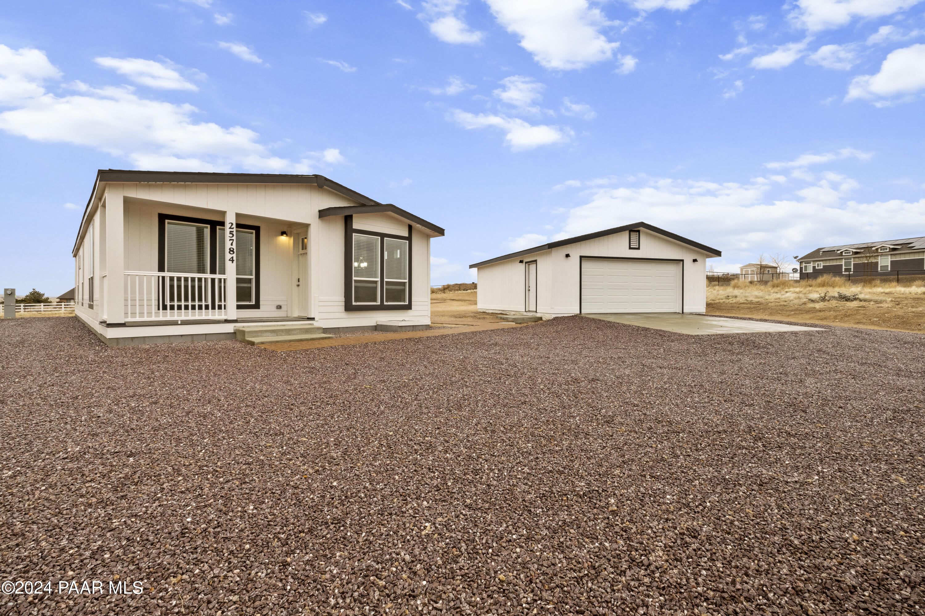 25784 Riesling Lane Paulden, AZ 86334 - Photo 1 of 15 a front view of a house with a yard