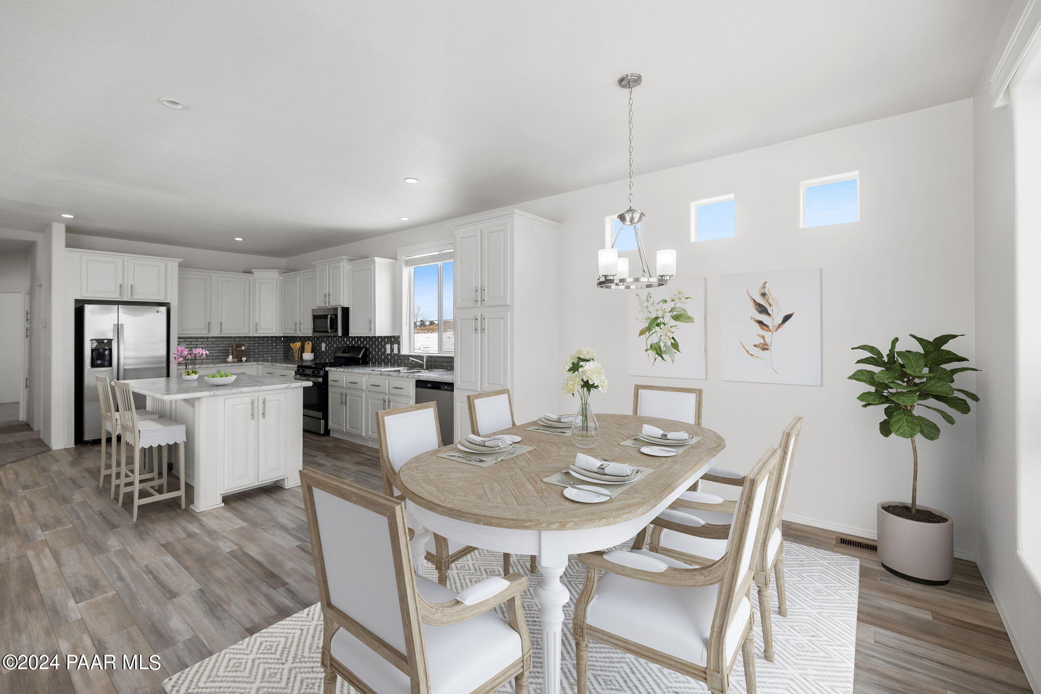 25784 Riesling Lane Paulden, AZ 86334 - Photo 3 of 15 a view of a dining room with furniture and wooden floor