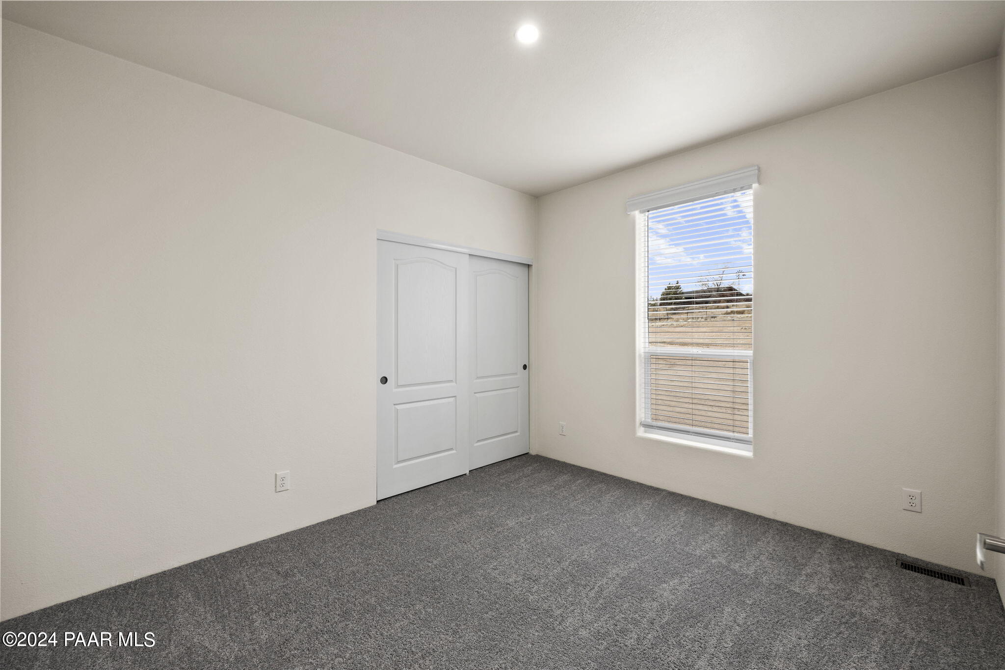 25784 Riesling Lane Paulden, AZ 86334 - Photo 9 of 15 an empty room with windows
