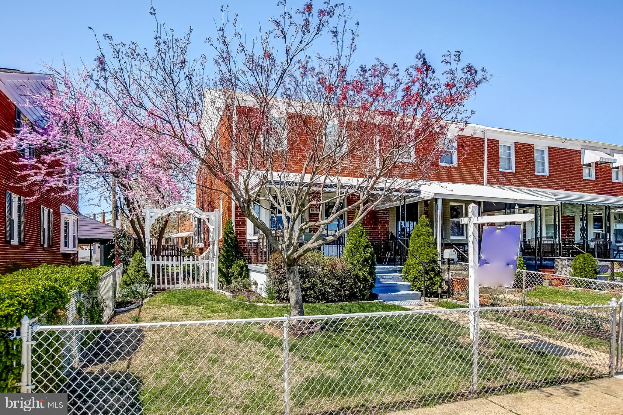 8329 Kavanagh Road Baltimore, MD 21222 - Photo 2 of 30 front view of a house with a yard