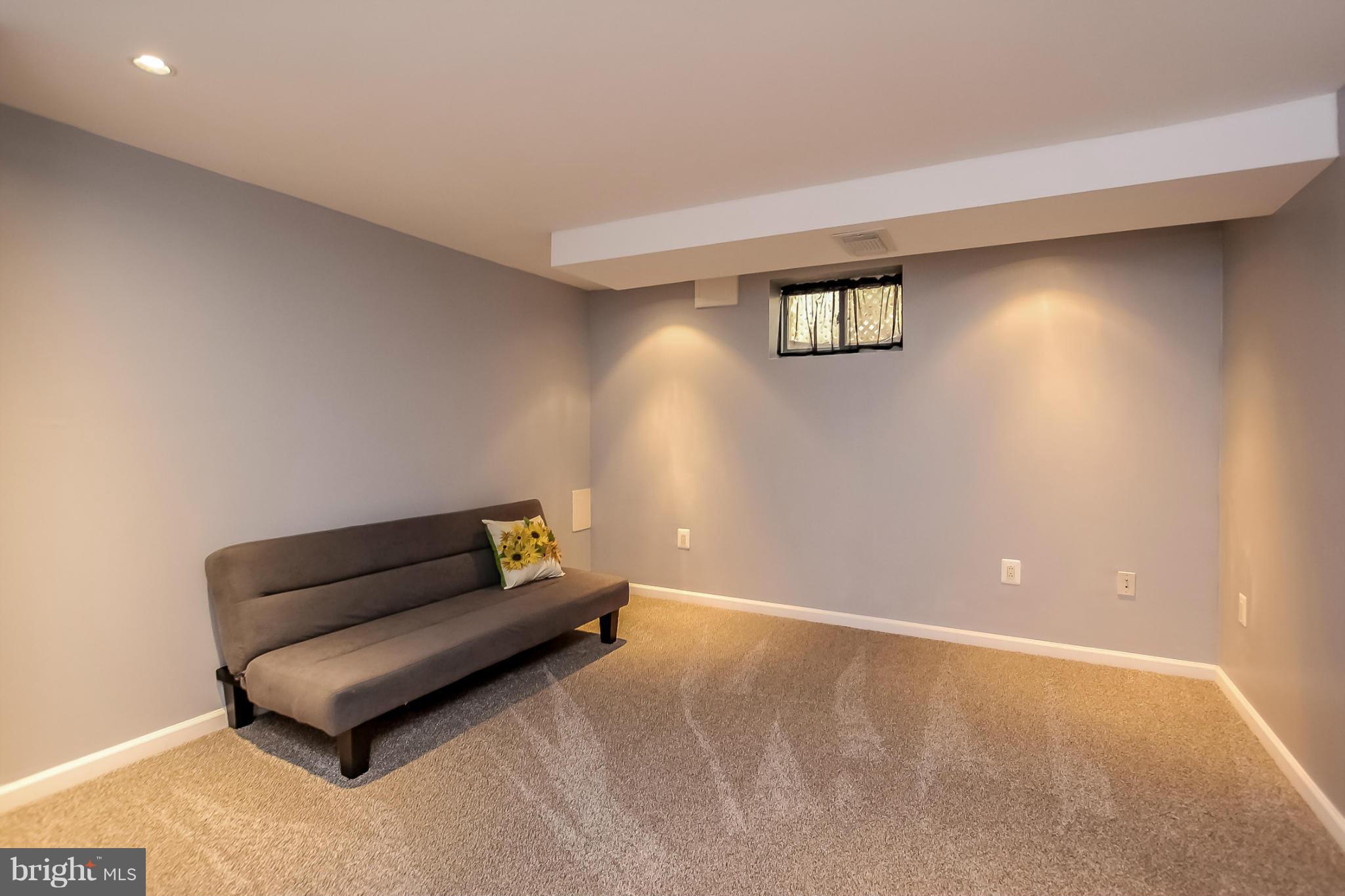 8329 Kavanagh Road Baltimore, MD 21222 - Photo 15 of 30 a living room with furniture and a wooden floor