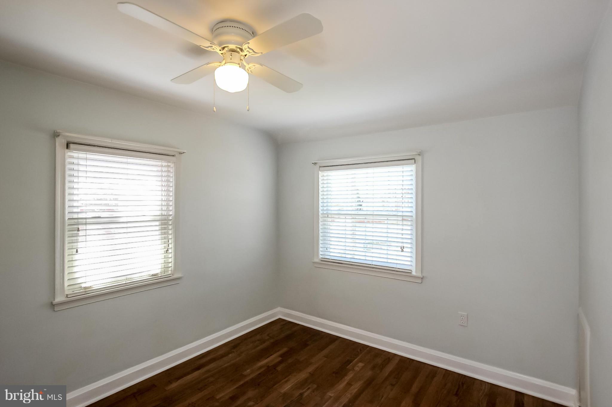 8329 Kavanagh Road Baltimore, MD 21222 - Photo 19 of 30 a view of an empty room with a window and a fan