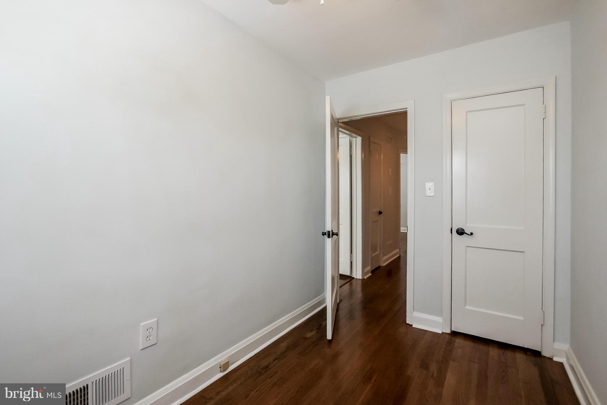 8329 Kavanagh Road Baltimore, MD 21222 - Photo 25 of 30 a view of a hallway with wooden floor