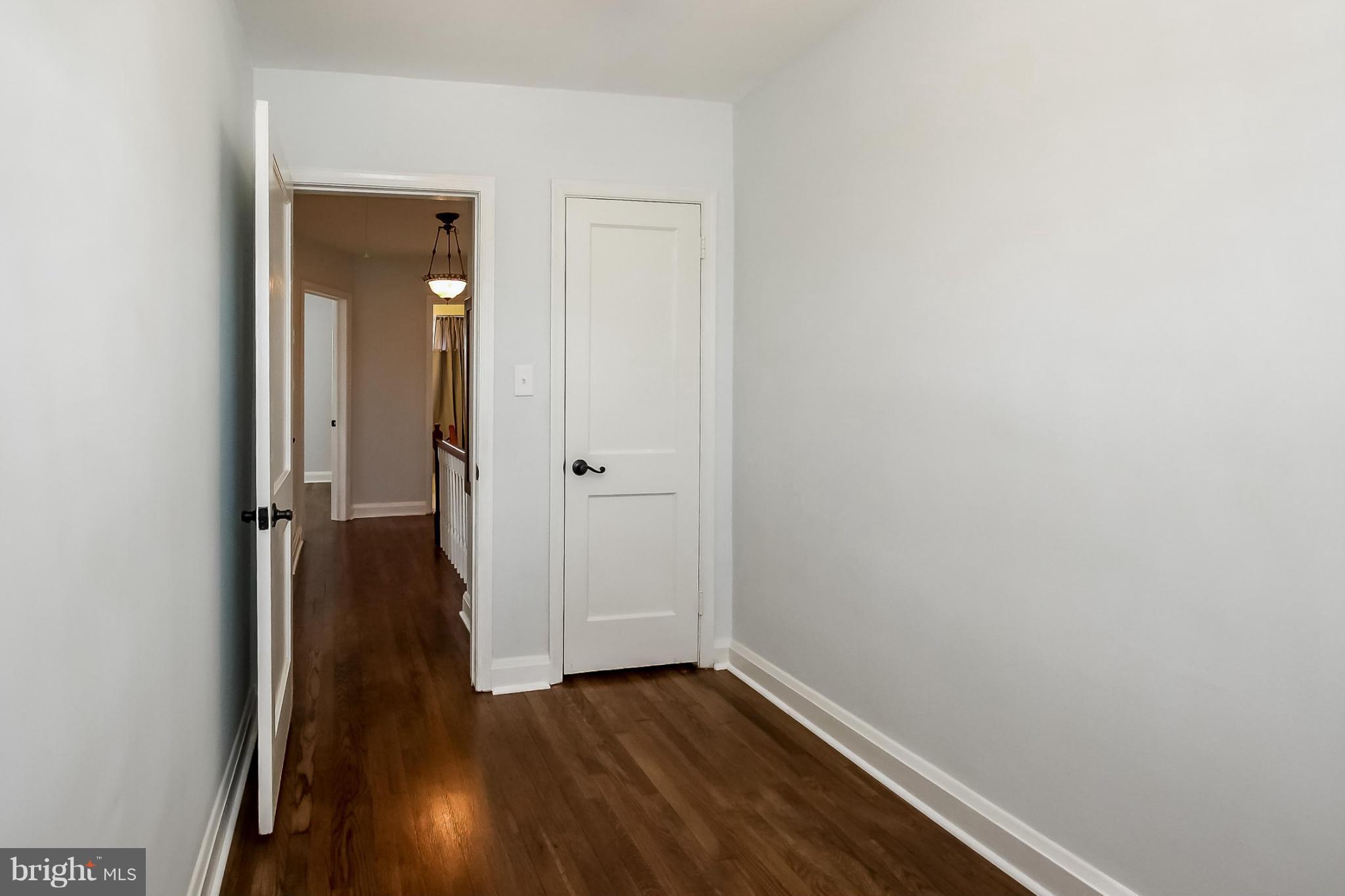 8329 Kavanagh Road Baltimore, MD 21222 - Photo 26 of 30 a view of a hallway with wooden floor