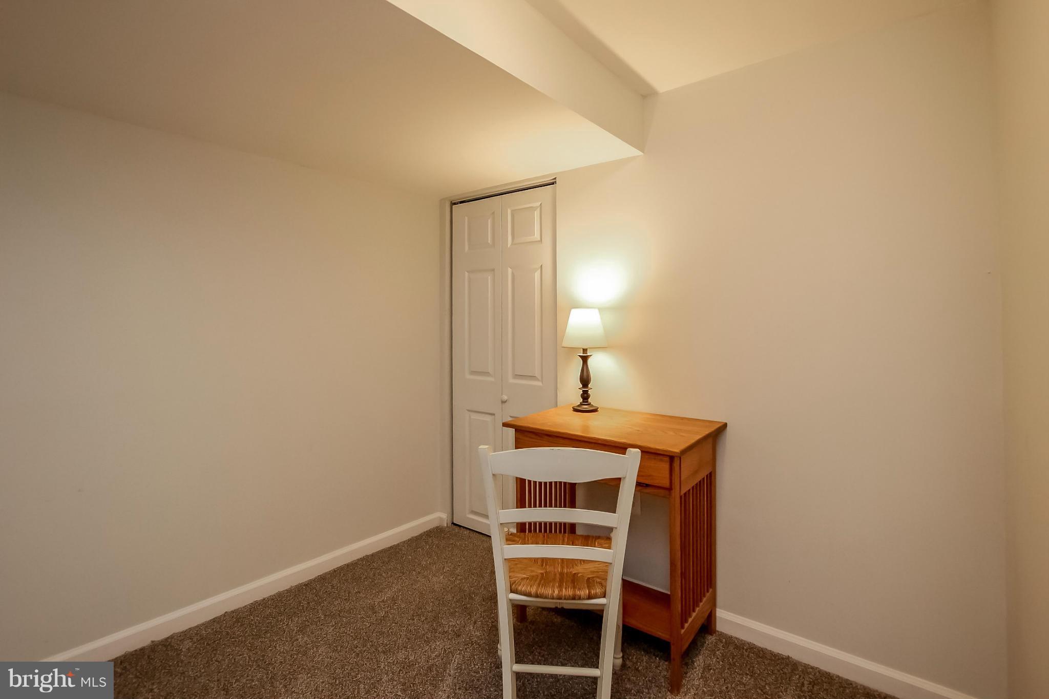 8329 Kavanagh Road Baltimore, MD 21222 - Photo 28 of 30 a room with a table and a chair