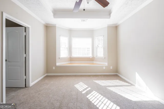 a view of wooden floor and windows in a room