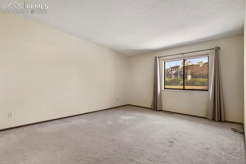 1130 Fontmore Road, Unit C Colorado Springs, CO 80904 - Photo 22 of 27 an empty room with window