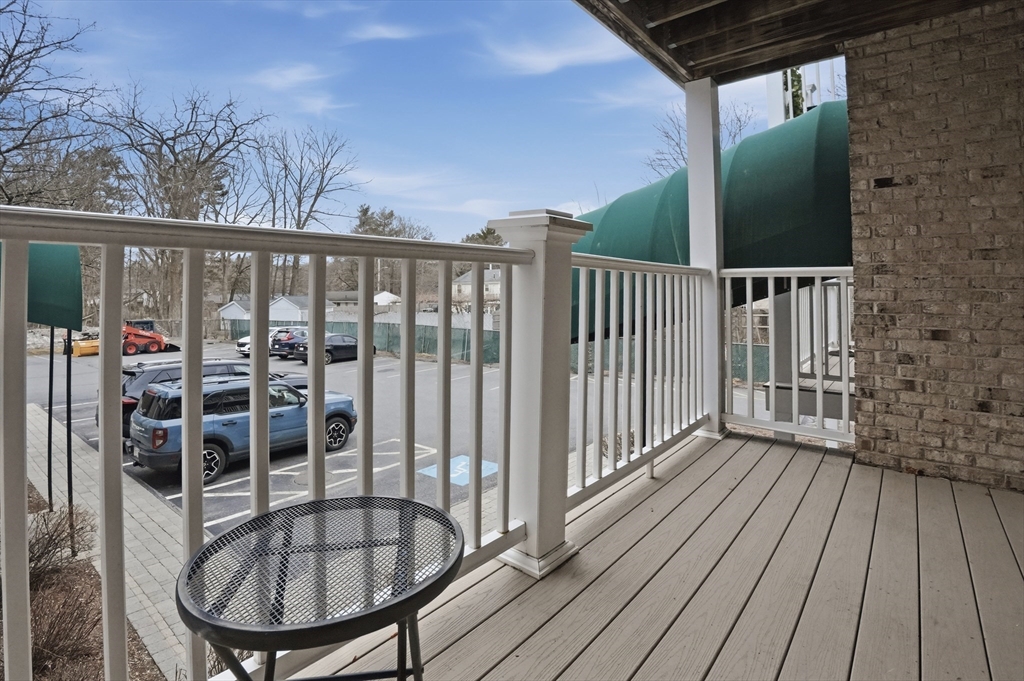 200 Manning Street, Unit 11C Hudson, MA 01749 - Photo 21 of 30 a view of a balcony with a potted plant