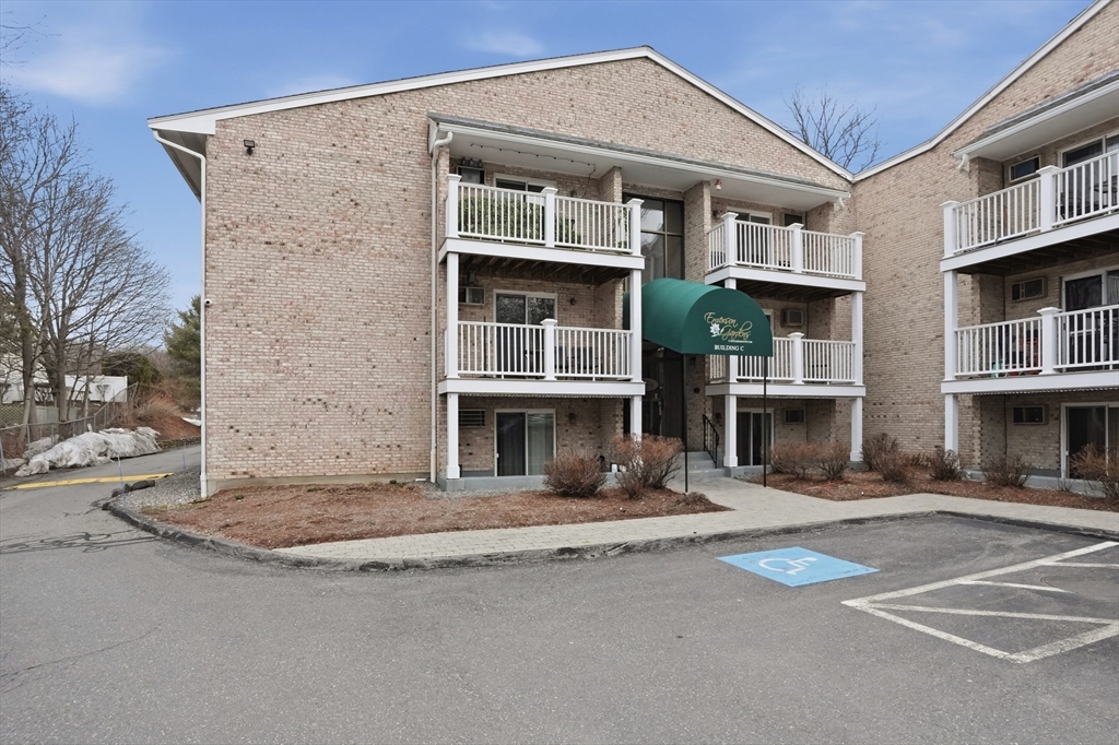 200 Manning Street, Unit 11C Hudson, MA 01749 - Photo 25 of 30 a front view of a house with street