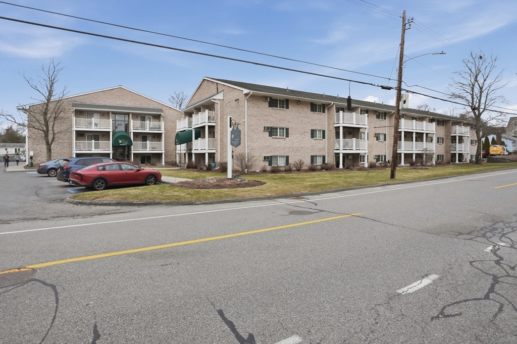 200 Manning Street, Unit 11C Hudson, MA 01749 - Photo 28 of 30 a front view of a building with street view