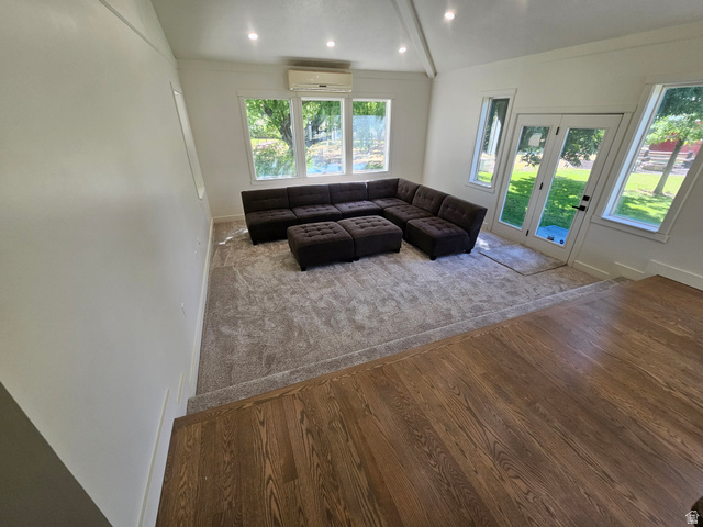 812 East Bates Cyn Road Tooele, UT 84074 - Photo 30 of 144 Sunlit living space featuring a vaulted ceiling with recessed lighting