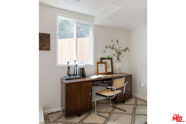 a view of a workspace with furniture