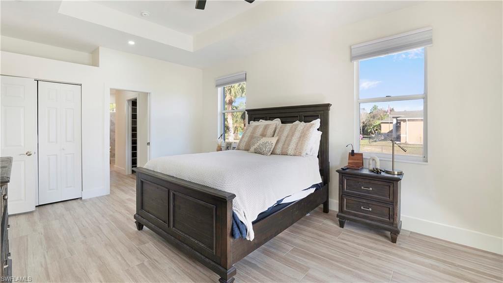770 17th Street Southwest Naples, FL 34117 - Photo 18 of 47 a bedroom with a bed and a dresser