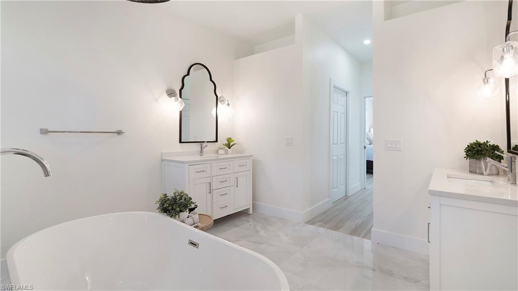 770 17th Street Southwest Naples, FL 34117 - Photo 22 of 47 a bathroom with a sink and a mirror