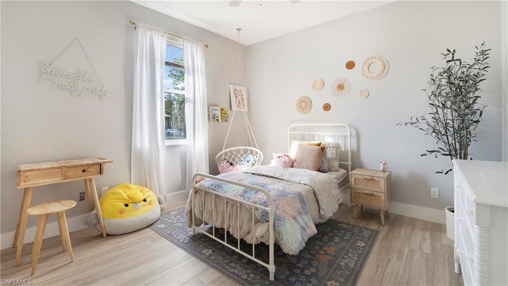 770 17th Street Southwest Naples, FL 34117 - Photo 24 of 47 a bed room with a bed and a window