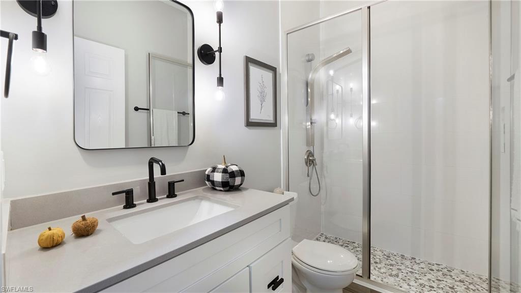 770 17th Street Southwest Naples, FL 34117 - Photo 27 of 47 a bathroom with a sink toilet and shower