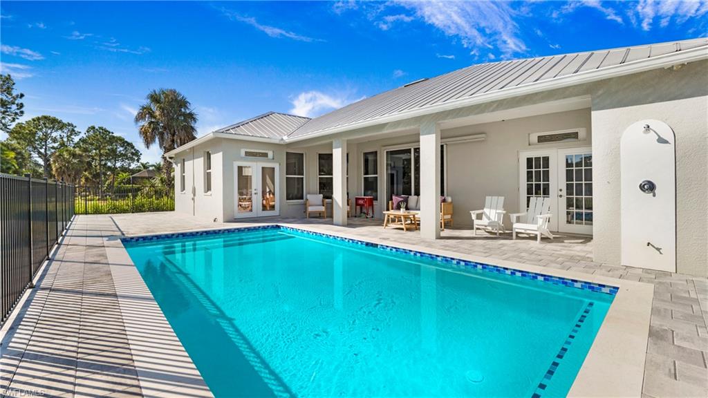 770 17th Street Southwest Naples, FL 34117 - Photo 31 of 47 a view of a house with pool table and chairs