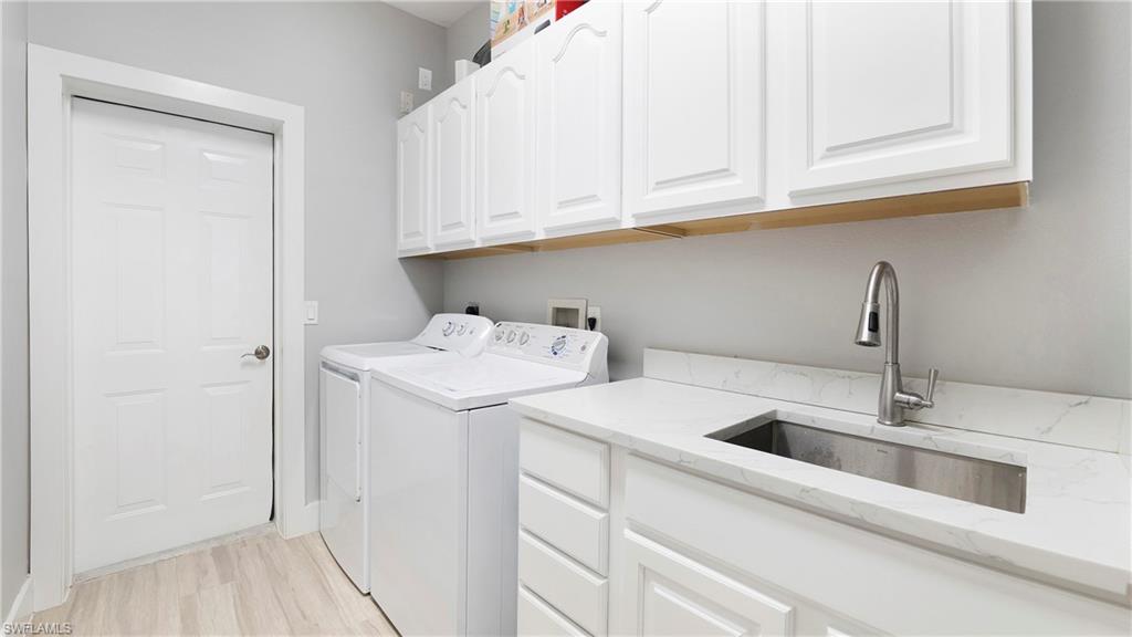 770 17th Street Southwest Naples, FL 34117 - Photo 33 of 47 a utility room with dryer and washer