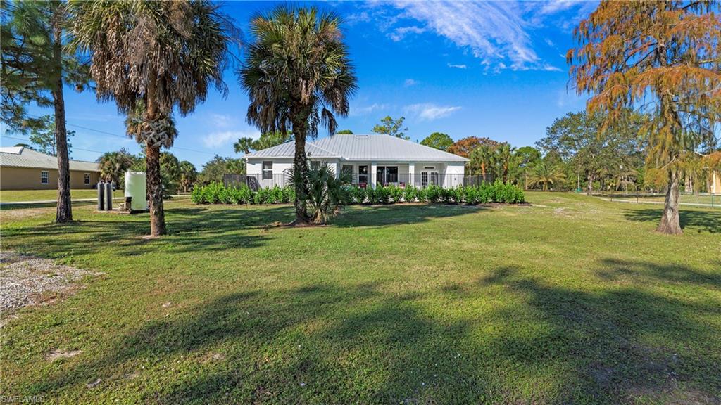 770 17th Street Southwest Naples, FL 34117 - Photo 38 of 47 a view of a house with a big yard