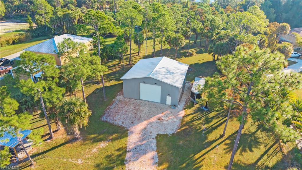 770 17th Street Southwest Naples, FL 34117 - Photo 4 of 47 view of a house with a yard