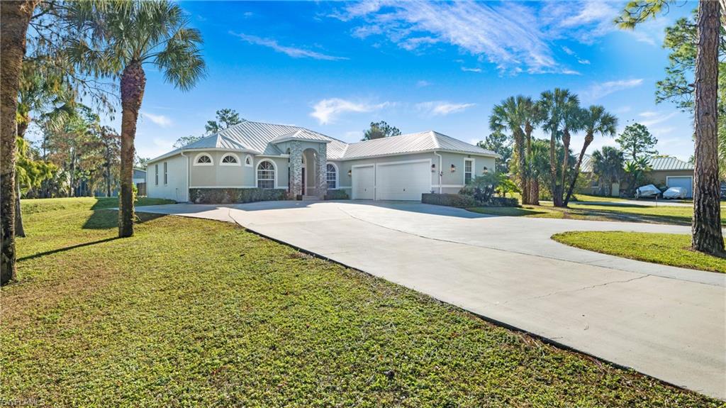 770 17th Street Southwest Naples, FL 34117 - Photo 45 of 47 a view of a house with a yard and pathway