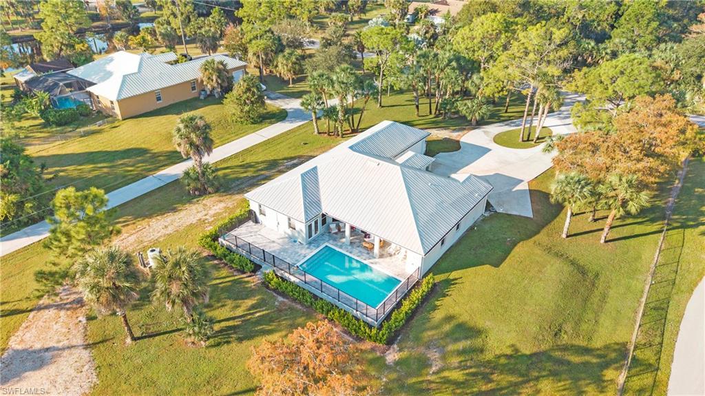 770 17th Street Southwest Naples, FL 34117 - Photo 46 of 47 a view of swimming pool with a yard