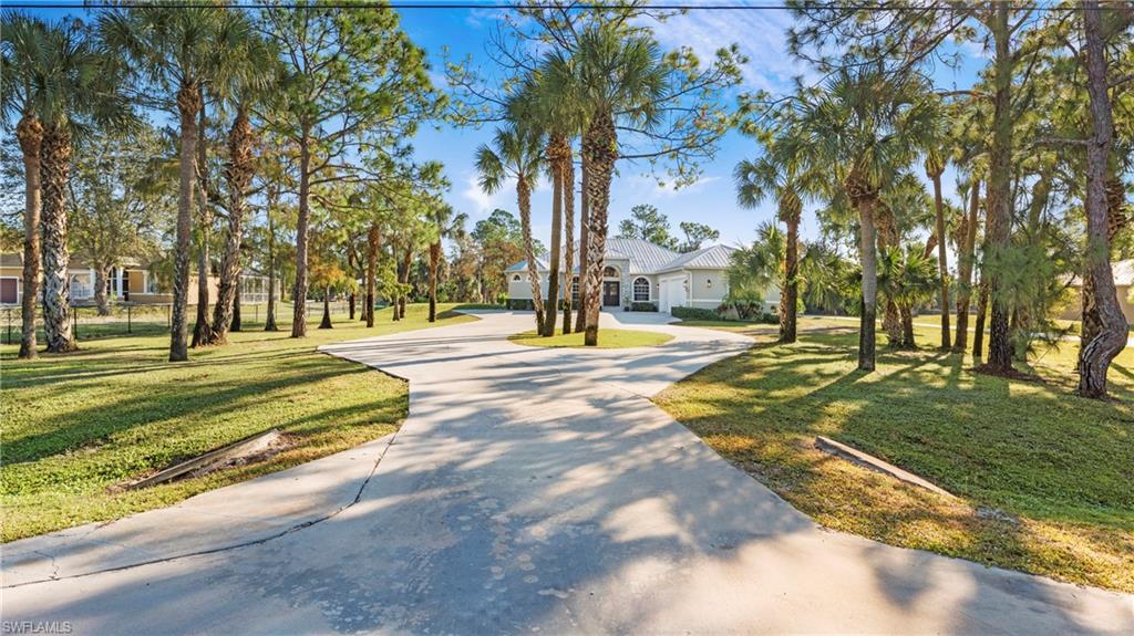 770 17th Street Southwest Naples, FL 34117 - Photo 5 of 47 a view of a playground with basketball court