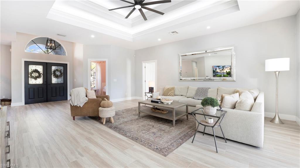 770 17th Street Southwest Naples, FL 34117 - Photo 8 of 47 a living room with furniture and wooden floor