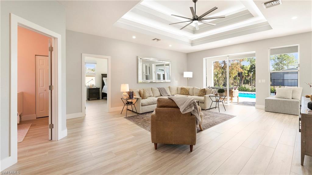 770 17th Street Southwest Naples, FL 34117 - Photo 9 of 47 a living room with furniture and a large window