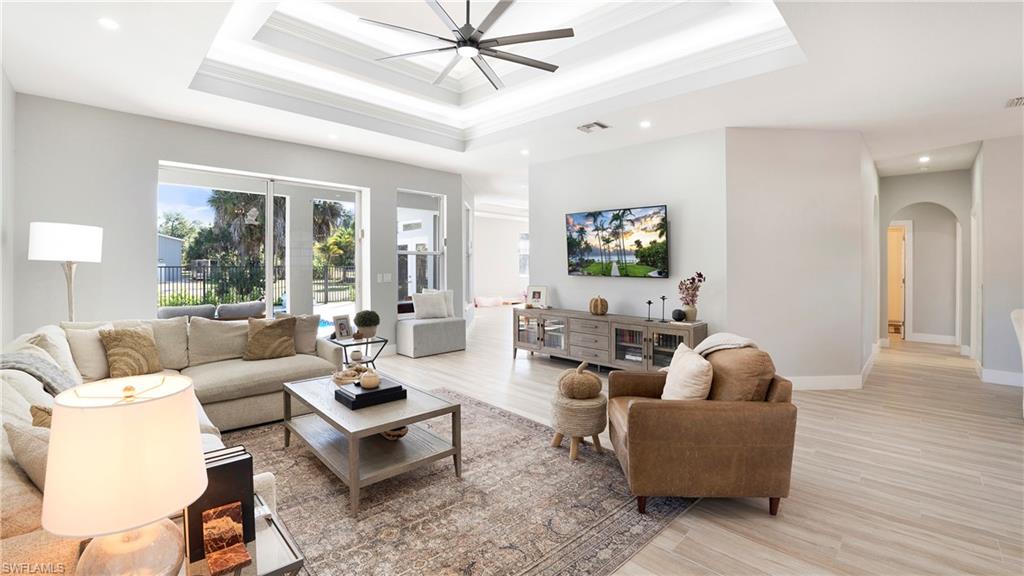 770 17th Street Southwest Naples, FL 34117 - Photo 10 of 47 a living room with furniture and a large window