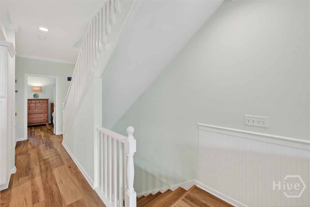 101 Butler Avenue, Unit G Tybee Island, GA 31328 - Photo 20 of 40 3rd floor hallway with laundry and storage closet on the left and guestroom directly ahead