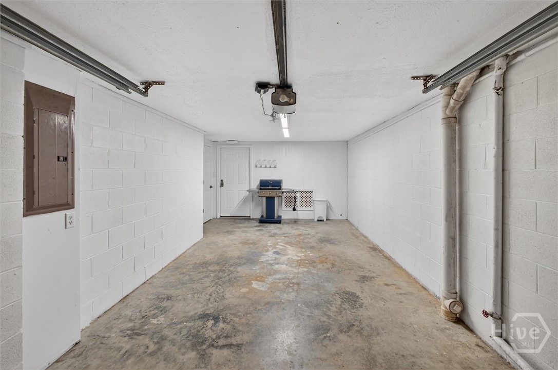 101 Butler Avenue, Unit G Tybee Island, GA 31328 - Photo 30 of 40 One car garage with storage room at the large back