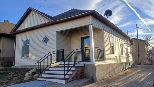 a front view of house with stairs