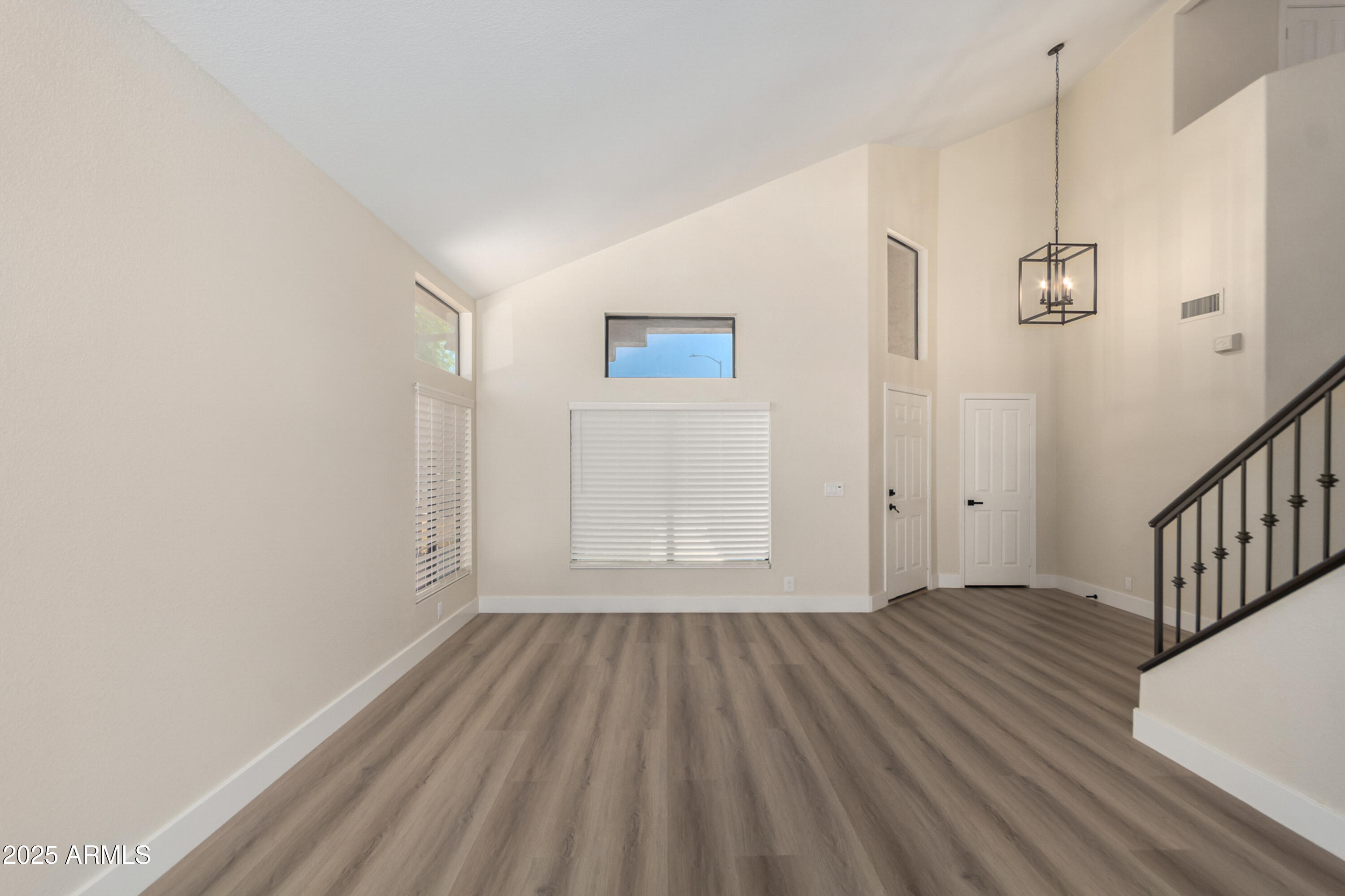 1630 South Lemon Mesa, AZ 85206 - Photo 13 of 55 a view of an empty room with wooden floor
