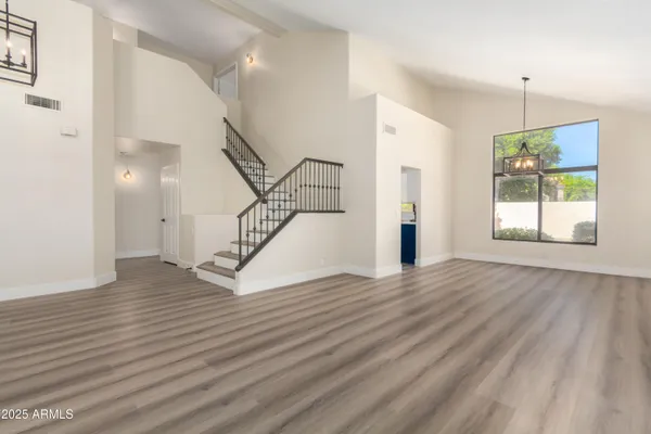 wooden floor in an empty room with a fireplace