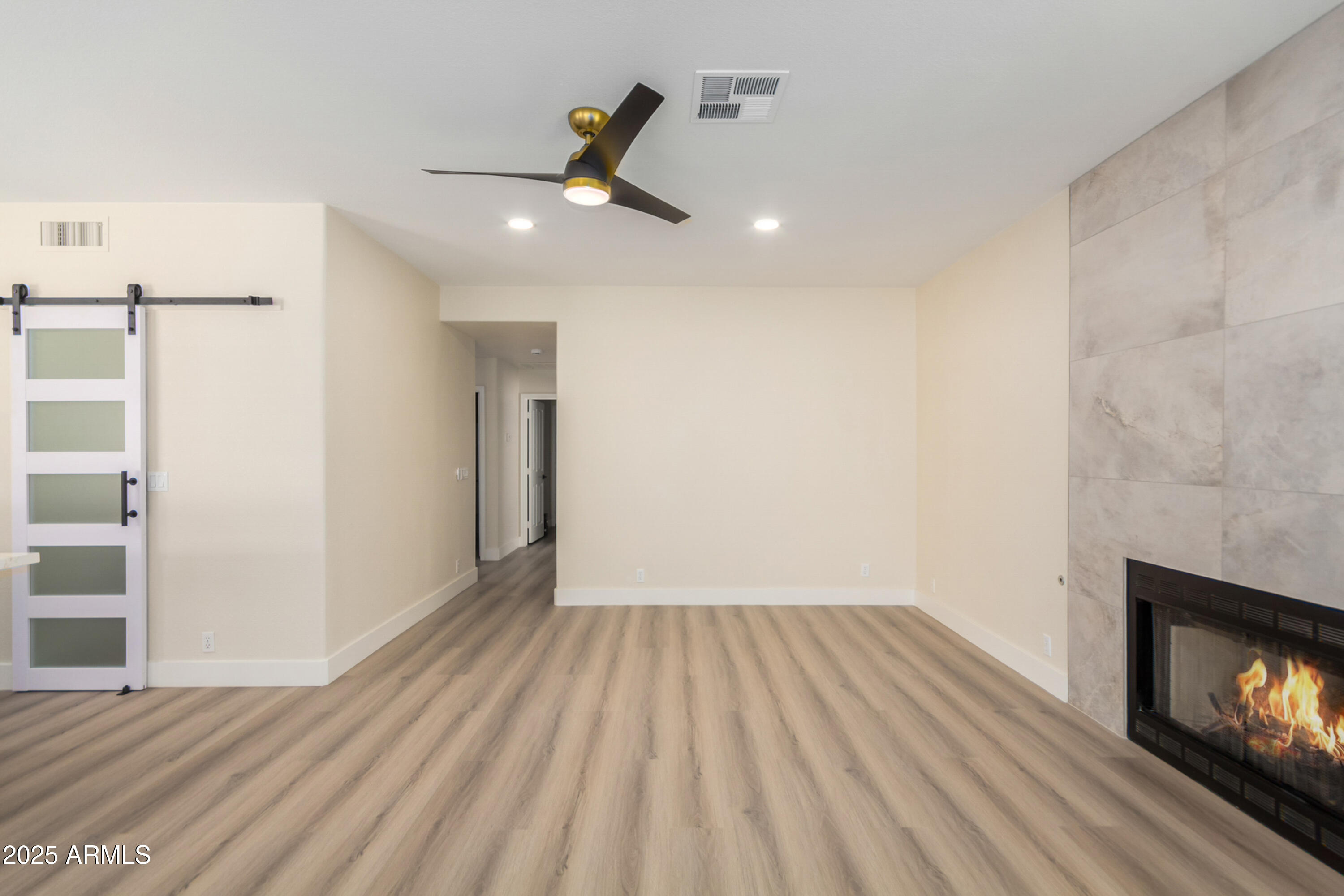 1630 South Lemon Mesa, AZ 85206 - Photo 17 of 55 wooden floor in an empty room with a fireplace