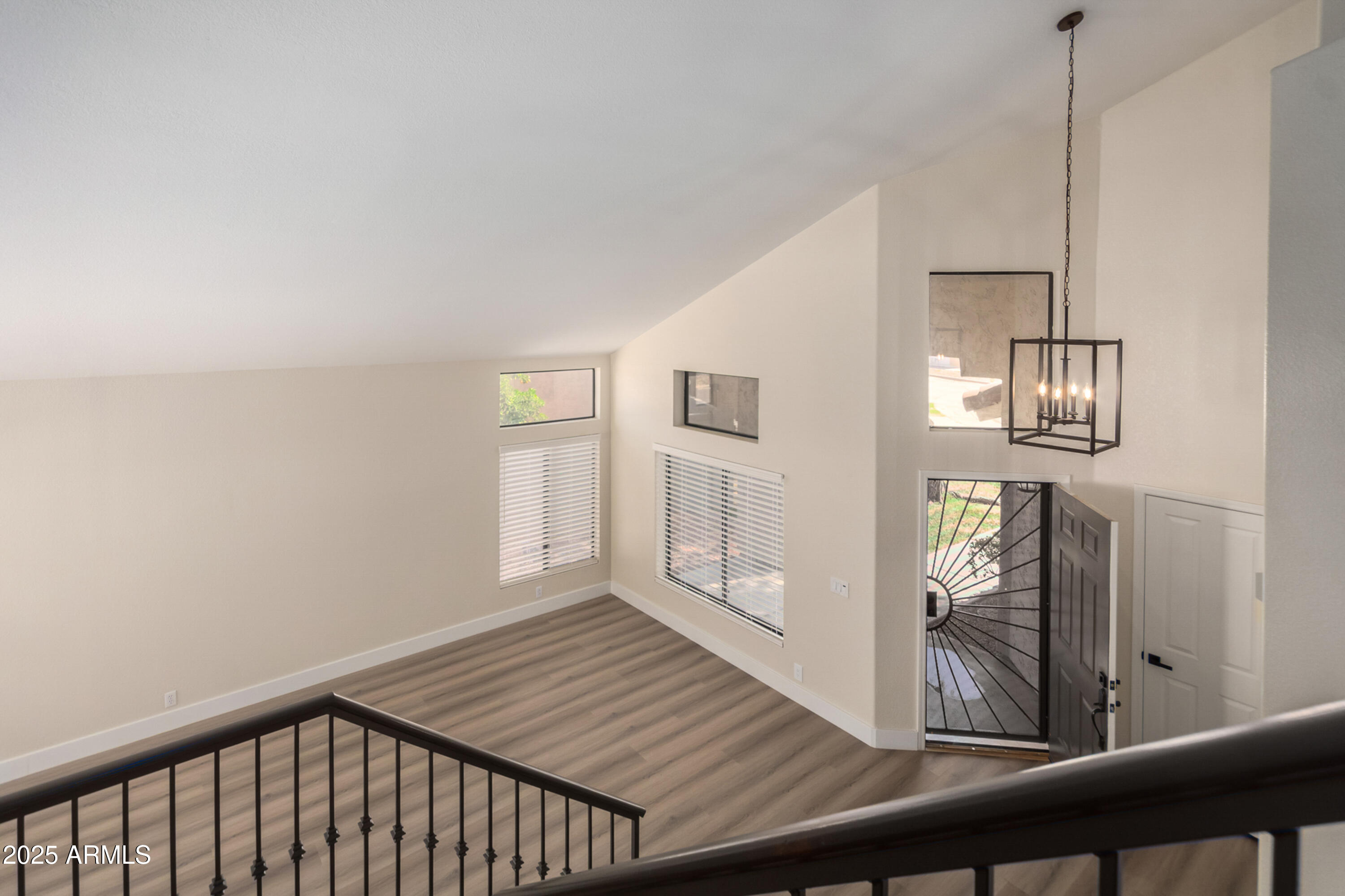 1630 South Lemon Mesa, AZ 85206 - Photo 24 of 55 a view of a hallway with wooden floor and staircase
