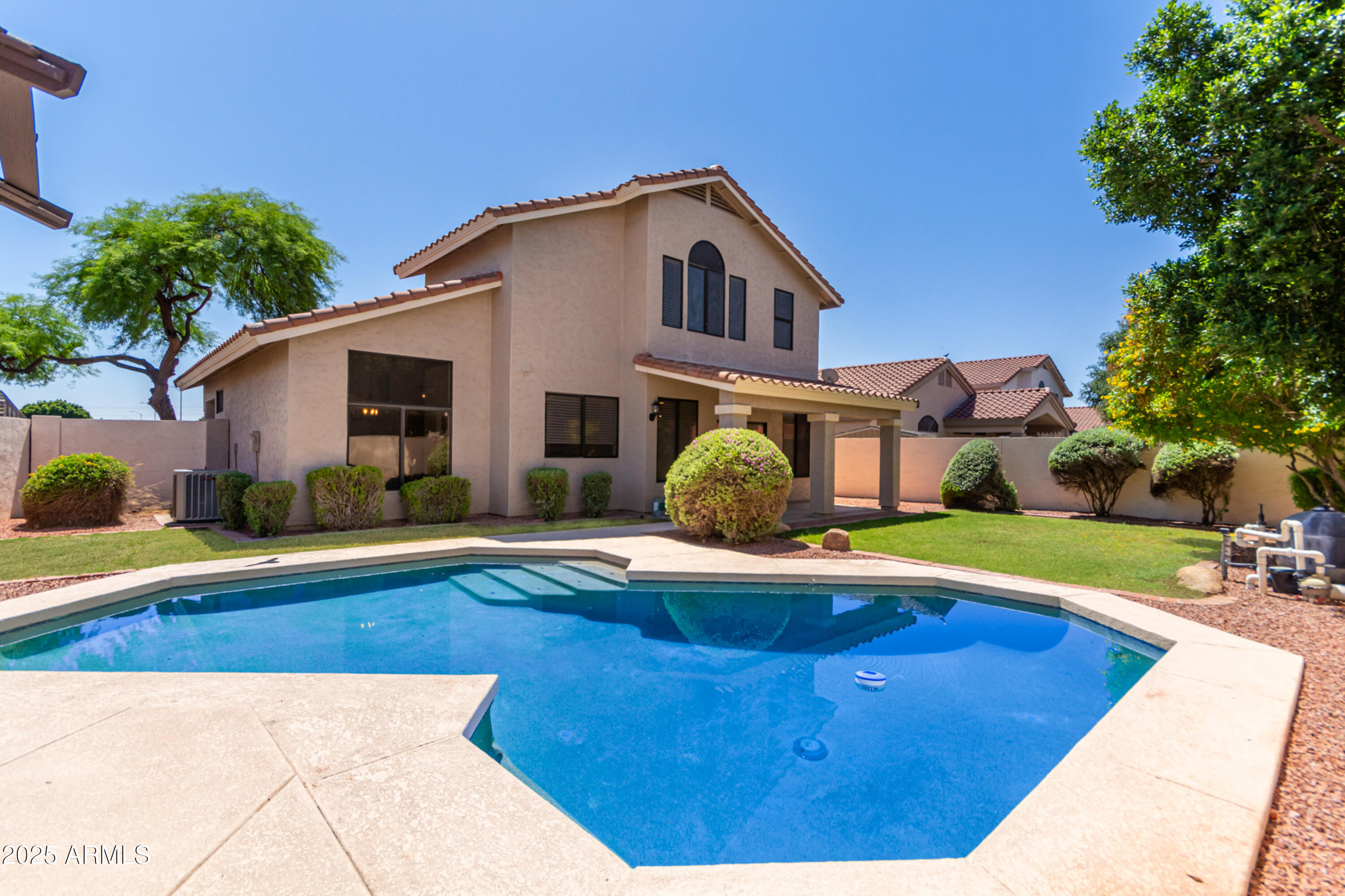1630 South Lemon Mesa, AZ 85206 - Photo 46 of 55 a front view of a house with swimming pool