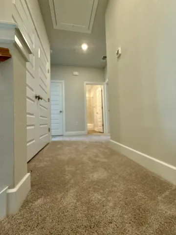 an empty room with a empty space and a window