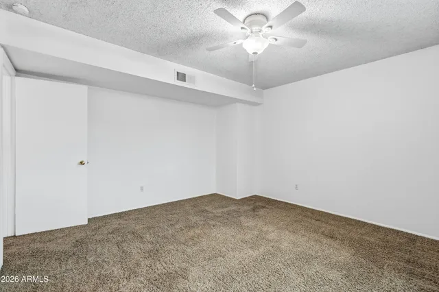 a view of a big room with carpet