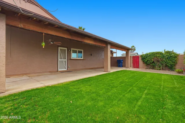 a front view of house with yard and outdoor seating