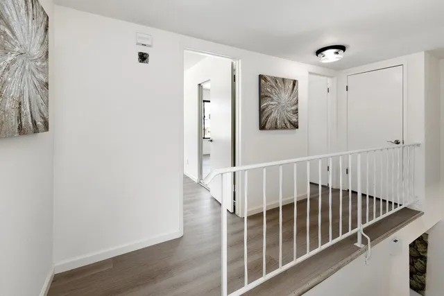 a spacious bedroom with a bed and a couch