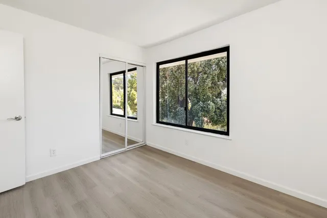 a view of a small space with wooden floor