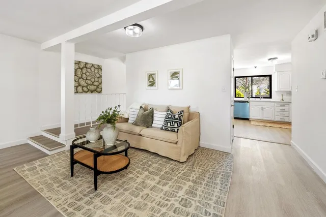 a living room with furniture and a rug
